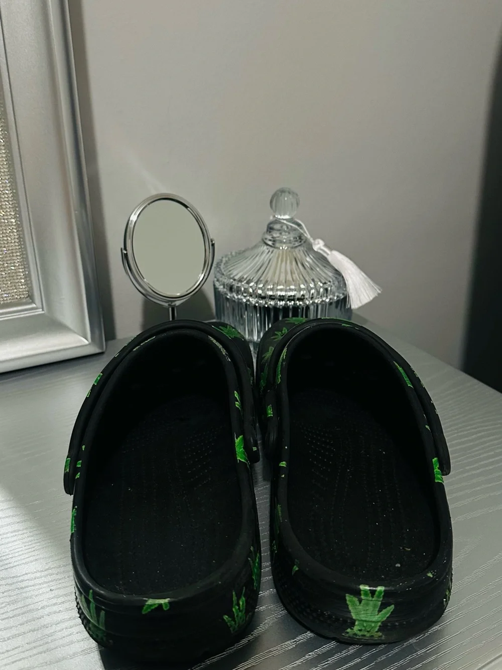 CROCS Black Slip-On Clogs with Green Leaf Print
